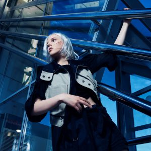 woman-posing-with-silver-hair-in-urban-setting-2026-03-26-06-03-07-utc